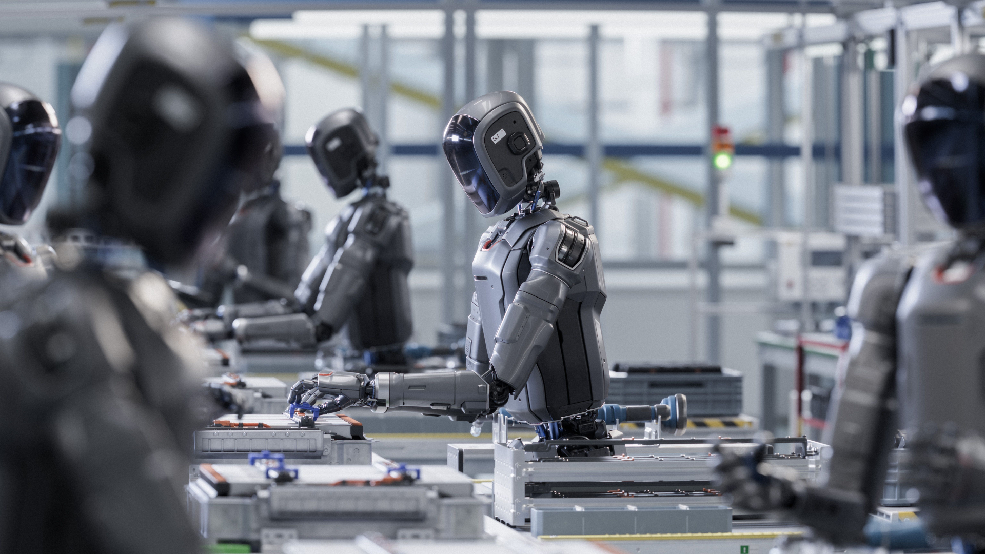 Roboți umanoizi lucrând într-o fabrică modernă